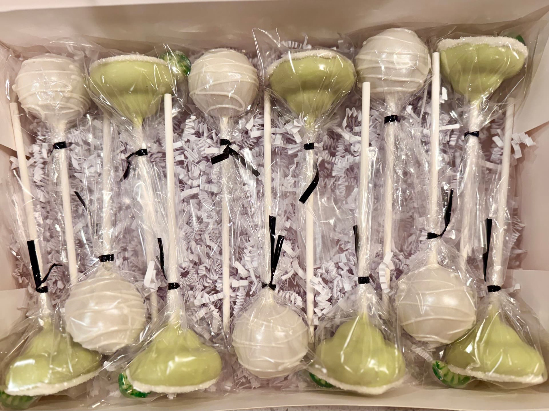 Blue cake pops with a waffle-cone pattern and rainbow sprinkles.