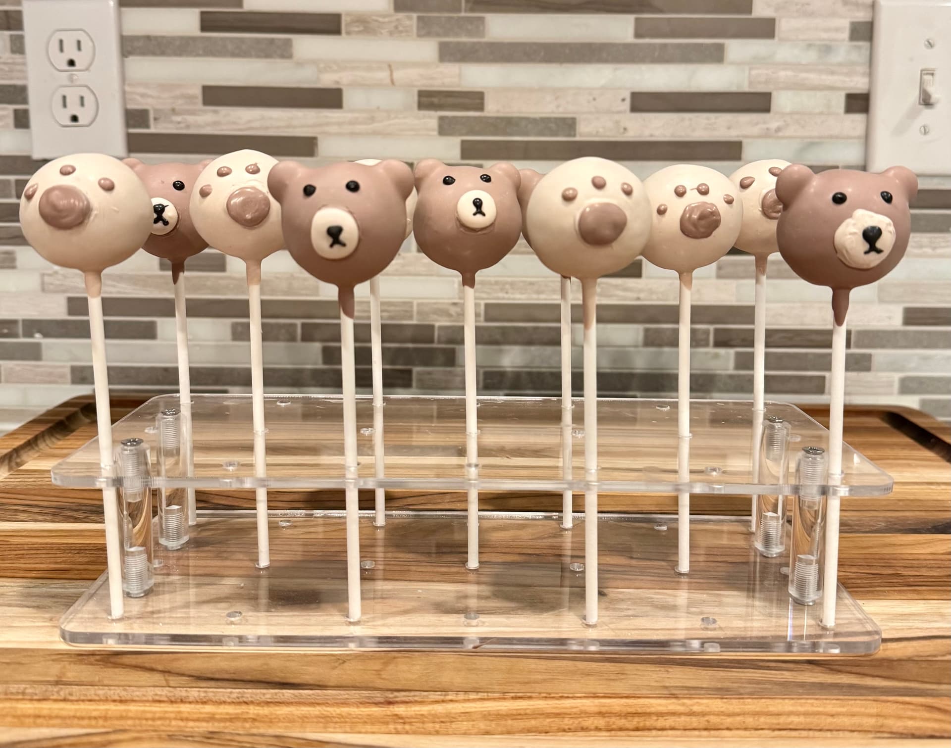 Cake pops with a black-and-white monogram letter S design.